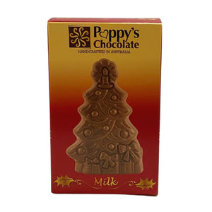 A vibrant red and orange box showcases a festive Christmas Tree-shaped milk chocolate. The label reads Poppy's Chocolate and Handcrafted in Australia. This gluten-free delight is adorned with decorations and surrounded by gift boxes.